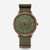 https://cdn.shopify.com/s/files/1/2384/2637/files/S01-NXT35-FI05_NaosXLEdition1905dunkelgrunbronze_Field20waldgrun_frontal_grau.jpg?v=1759312415